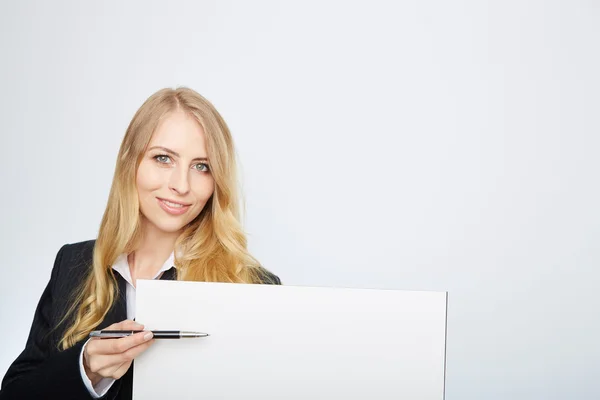 Pretty blonde girl with a blank presentation board Stock Picture
