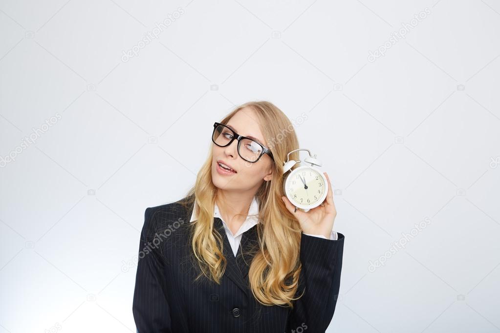 Full isolated portrait of a beautiful caucasian businesswoman locking at the clock. highnoon