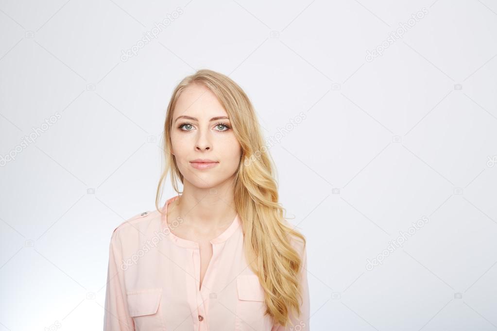 woman is standing with a rose blouse. isolated on white