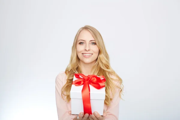 Young blond woman with present box. — Stock Photo, Image