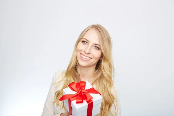 Young blond woman with present box. — Stock Photo, Image