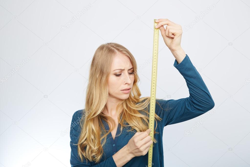 young woman with a tape measure