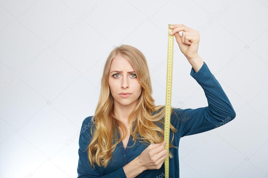 young woman with a tape measure