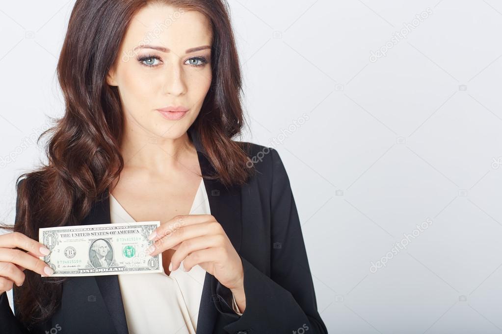 Young businesswoman with a dollar in hand