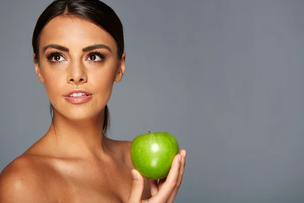 Smiling woman with apple — Stock Photo, Image