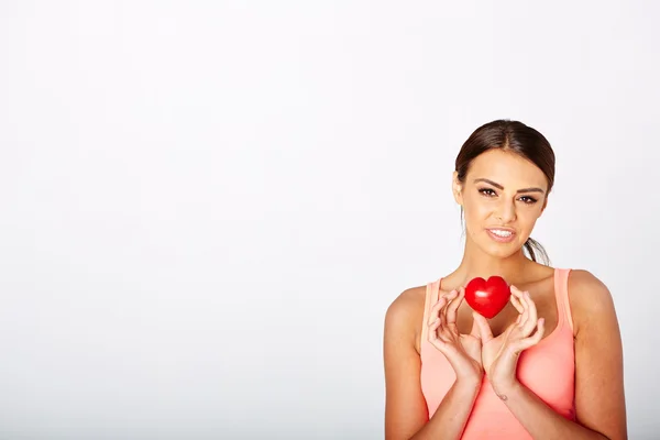 Heart shape in womans hands. — Stock Photo, Image