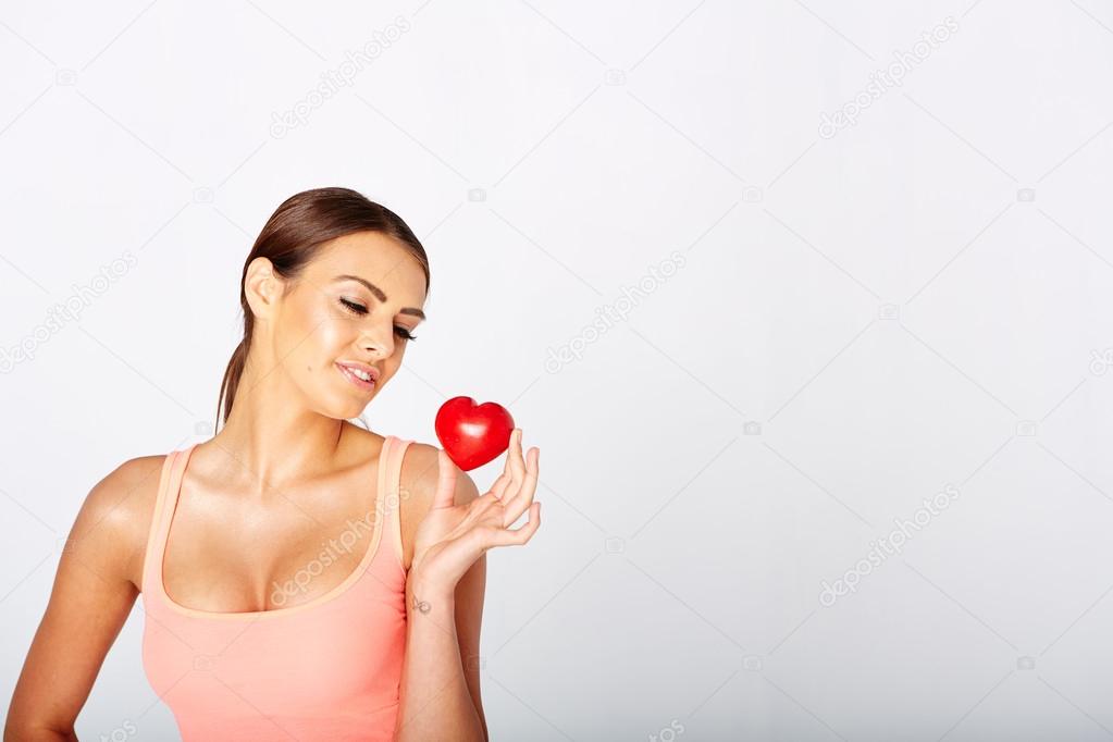Heart shape in womans hands.