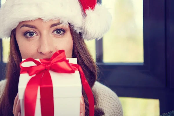 Woman with a Christmas Gift — Stock Photo, Image