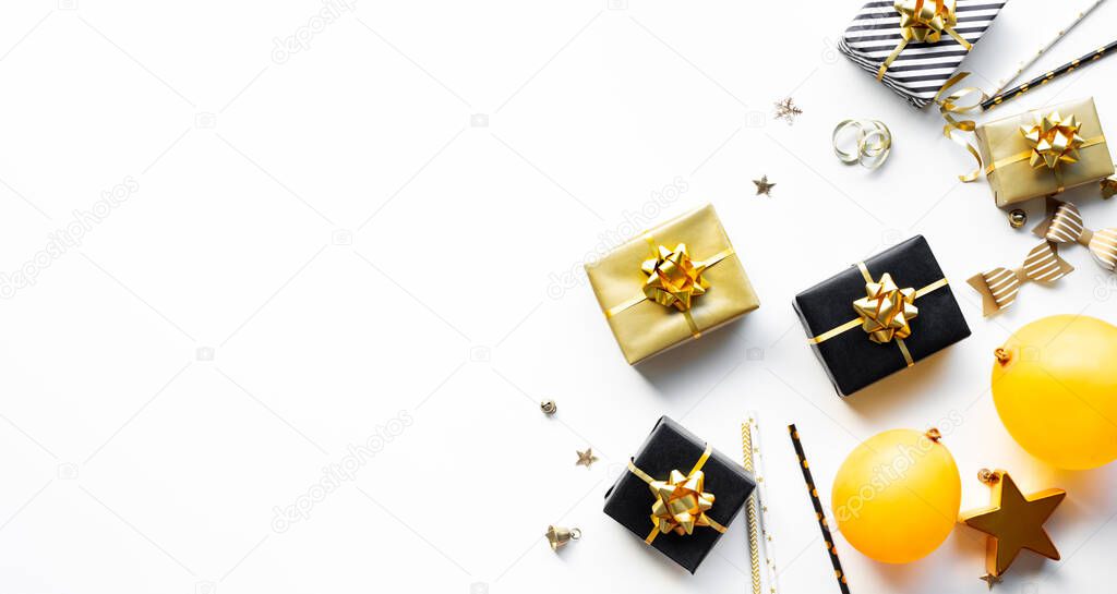 Merry christmas,xmas and new year celebration concepts with gift box and ornament in black and golden color on white background.winter season and anniversary day