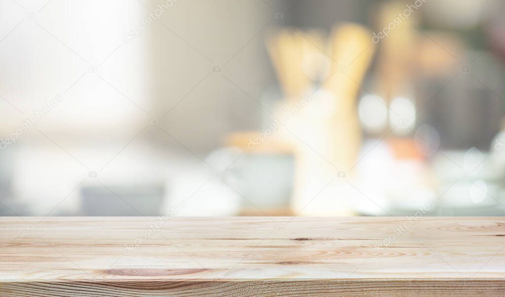 Wood table top on blur kitchen counter background.For montage product display or design key visual layout.