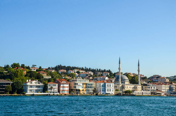 View of the Beylerbey Mosque, modern buildings and the embankment, from the Bosphorus, Istanbul, Turkey