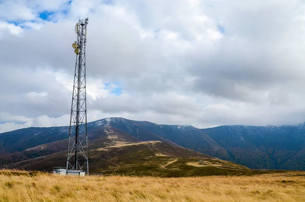 Mobile telecommunication tower or cell tower with antenna and electronic communications equipment in Carpathian mountains, Borzhava ridge, Ukraine