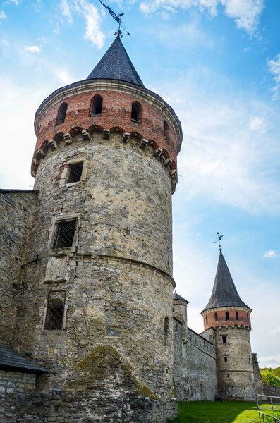 Photo of old ancient stone castle with many high towers in Kamyanets-Podilsky, Ukraine