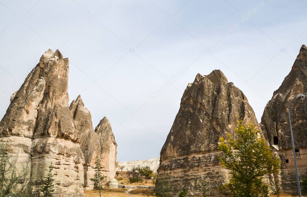 Beautiful Fabulous unique forms of sandstone landscape with eroded bizarre rock formations of Cappadocia, Turkey. Beauty of nature concept background.