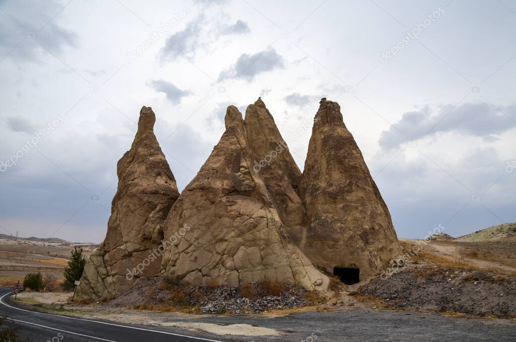 Beautiful Cappadocia landscape. Unique geological formations with stone rock houses and caves Tourism and travel.