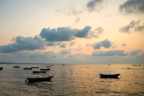 Fishing boats, small boats floating in the sea at sunrise, Conce