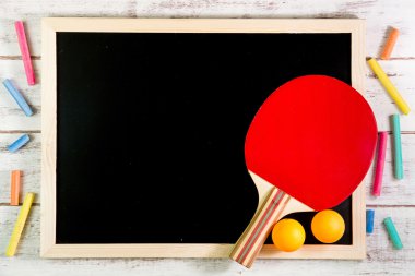 Blank blackboard, Ping pong ball on wooden table.Template mock u