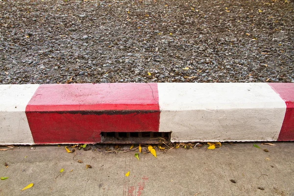 Red and White sign on the sidewalk background — Stock Photo, Image