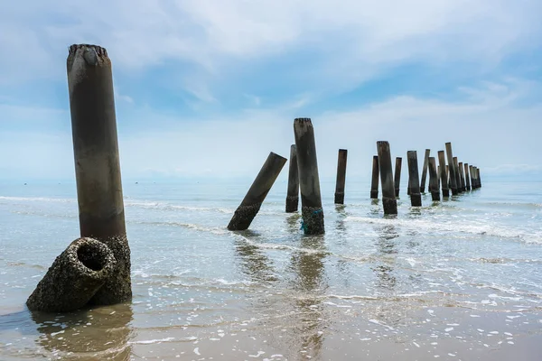 Stunning views of the concrete columns of the old port that crumbled in the sea of Thailand.