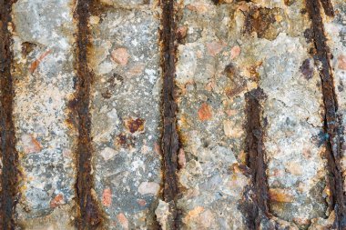 Steel corrosion in reinforced concrete. Reinforced concrete with damaged and rusty steel bar in marine and other chloride environments. Degraded concrete and corrosion of reinforcement bars