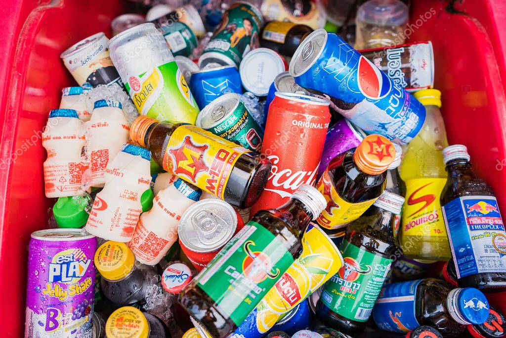 Bangkok, Thailand - April, 04, 2021 : bottles and cans of soft drinks in an ice box, taken at Bangkok, Thailand.Abundant thirst relieving heat from summer heat in Thailand