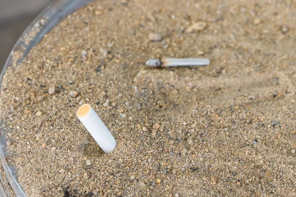 Cigarette butts. Smoking is bad for your health