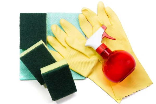 Luvas de borracha amarelas e esponjas de limpeza em napki de limpeza azul — Fotografia de Stock