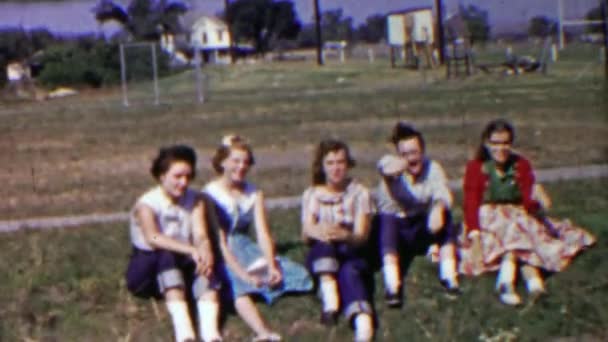 School girl friends gang hanging out waiting for ride — Stock Video