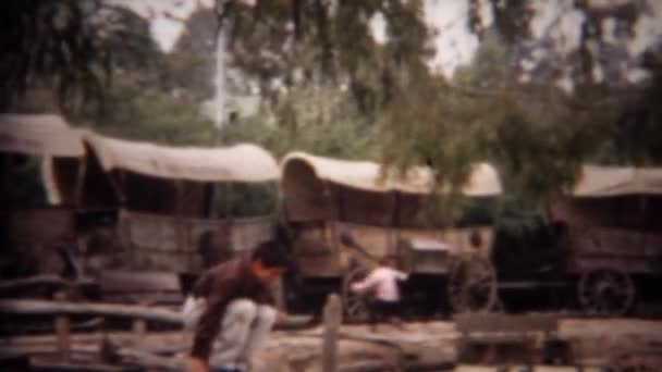 Boy exploring old western stagecoach amphitheatre exhibit — Stock Video