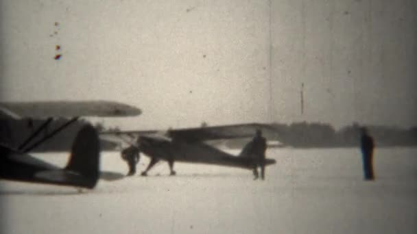 Biplanes taxi on frozen lake — Stock Video