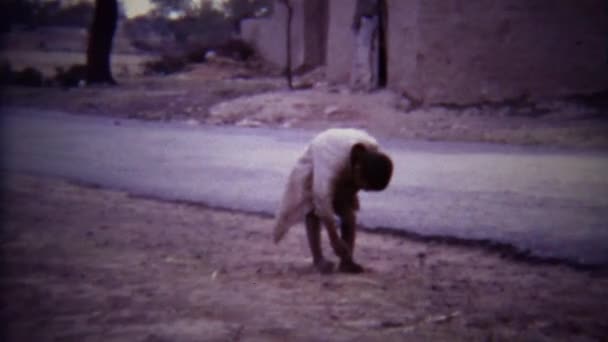 Kid roams on rural middle eastern road — Stock Video