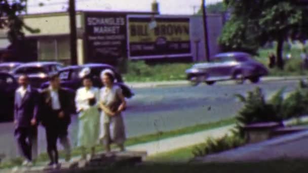 Family coming home from church — Stock Video