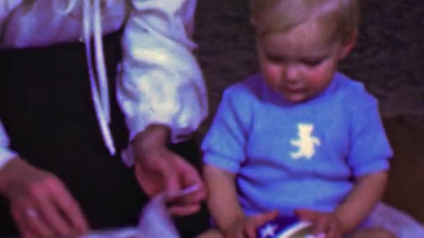 Baby underwhelmed at crab food gift — Stock Video