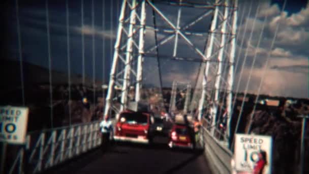 Car crossing narrow suspension bridge — Stock Video