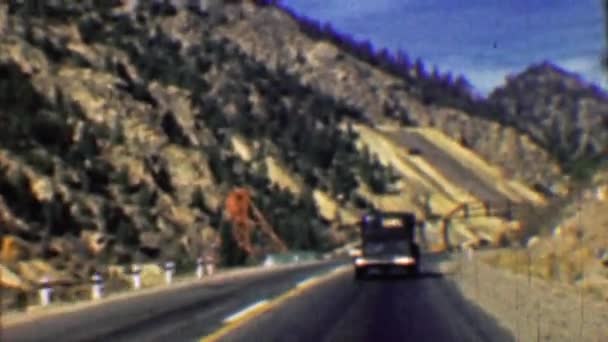 Interstate highway 70 two lane road past mining tailings — Stock Video