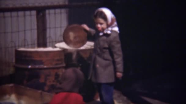 Poor girls playing in industrial sandbox — Stock Video