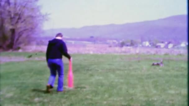 Dad swings wiffle baseball bat hits ball — Stock Video