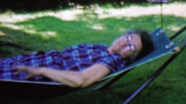 Grandma resting outdoor shade hammock — Stock Video