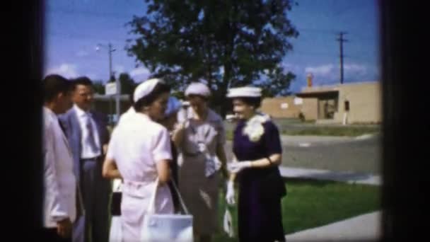 A gathering talking and a close up is done on a broach — Stock Video