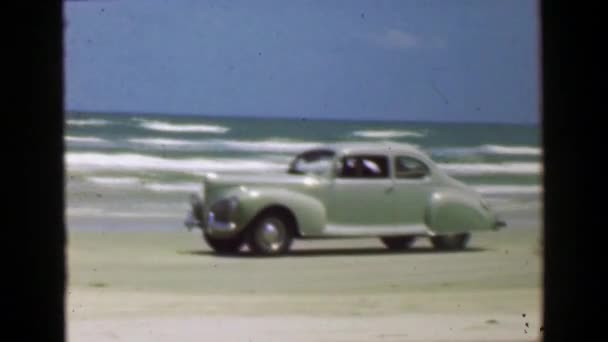 Car driving on ocean beach — Stock Video