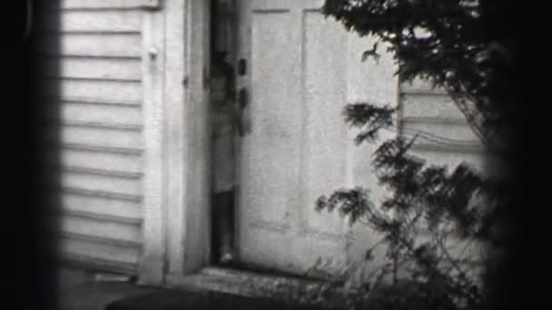 Girl opens front door and runs towards street escape — Stock Video