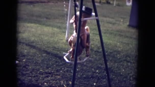 A child is seen swinging — Stock Video