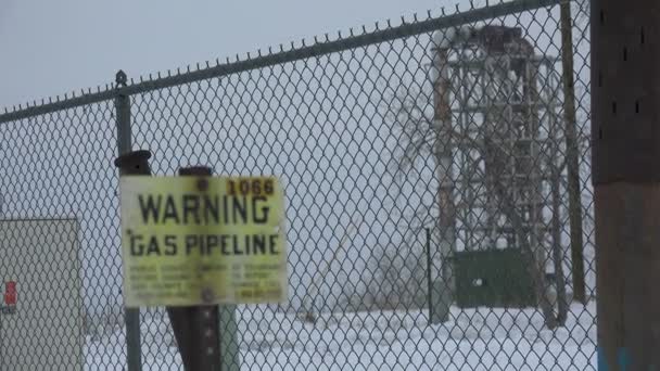 Gas warning outside a old factory — Stock Video