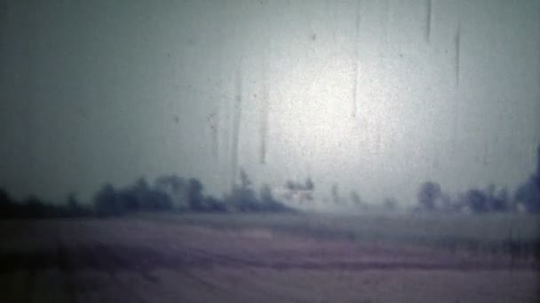 Airplane crop dusting over soybean fields — Stock Video