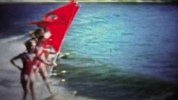 Girls with flags in water — Stock Video