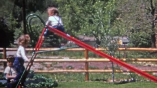 Toddler sliding backwards down slide — Stock Video