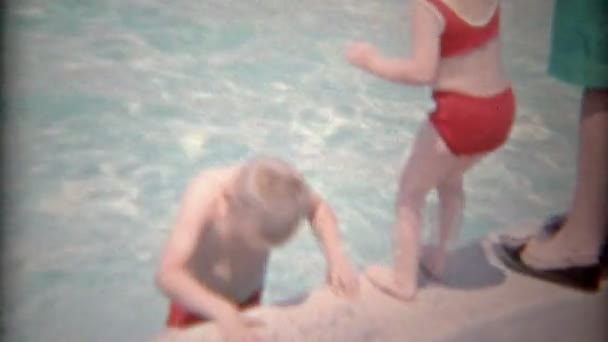 Brothers in public pool playing around edge — Stock Video