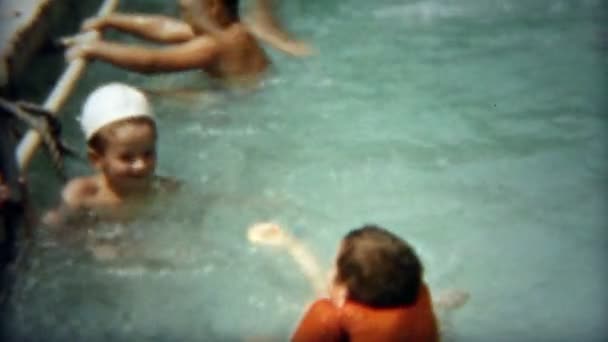 Boys playing poolside throwing at friends — Stock Video