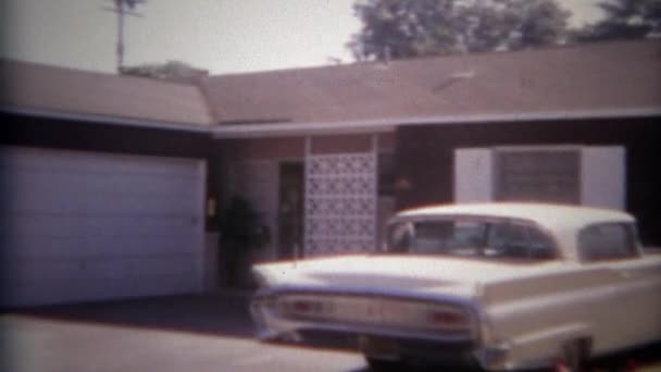 Car parked in driveway of home — Stock Video