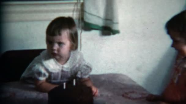 Girls blowing out two candles — Stock Video